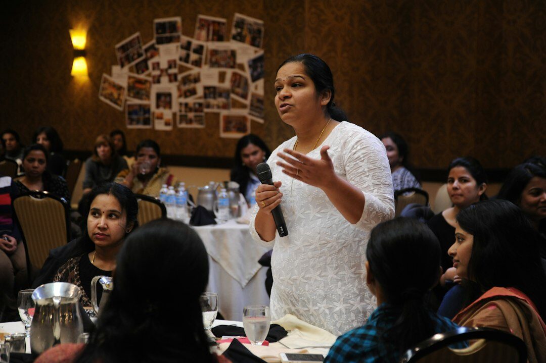 confident woman presenting to audience