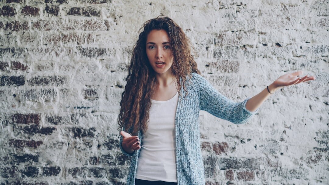 woman gesturing while talking